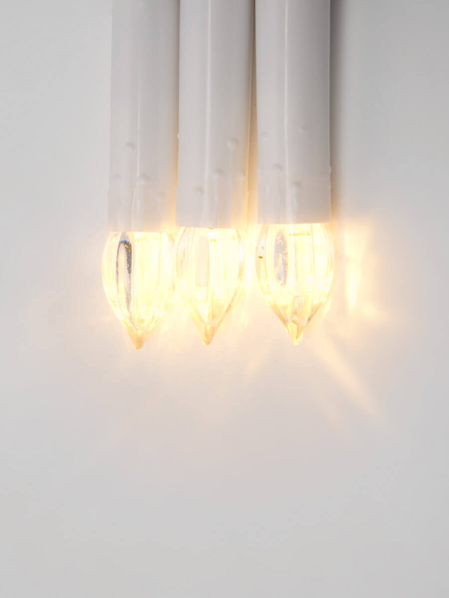 фото светодиодная гирлянда uniel свечки 220v теплый белый uld-s0600-030/sga warm white ip20 candles ul-00005469 | 220svet.ru